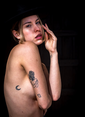 Sensuous Venezuelan model flaunts curves and beauty in traditional attire, elegantly topless.の写真素材