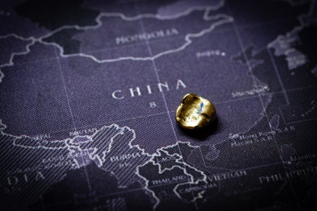 A gleaming gold dental crown shines in the foreground.の写真素材