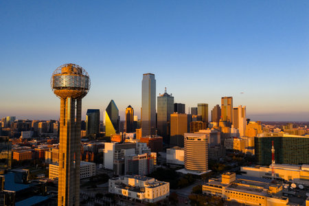 Aerial view of Dallas reveals a vast, vibrant metropolis, its skyline rising over highways and sprawling suburbs across the DFW regionâan inland hub of industry, transit, and culture.のeditorial素材