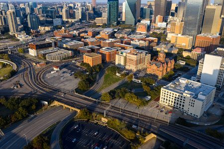 An aerial view of Dealey Plaza reveals its historic layout in downtown Dallas, where the curved roads, green lawns, and landmark buildings frame the site tied to JFKâs 1963 assassination.のeditorial素材
