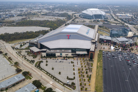 An aerial view reveals Globe Life Fieldâs sleek retractable roof and modern design in Arlington, rising beside its predecessor as the home of the Texas Rangers.のeditorial素材