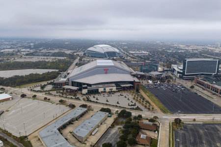 An aerial view reveals Globe Life Fieldâs sleek retractable roof and modern design in Arlington, rising beside its predecessor as the home of the Texas Rangers.のeditorial素材