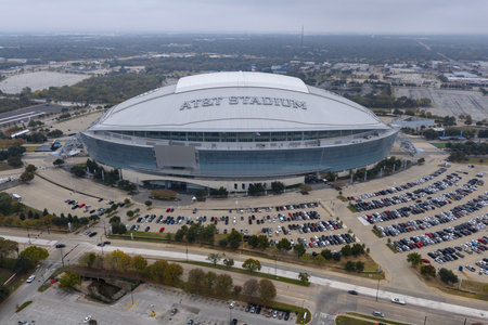 An aerial view captures AT&T Stadiumâ€™s massive retractable-roof design rising over Arlington,...