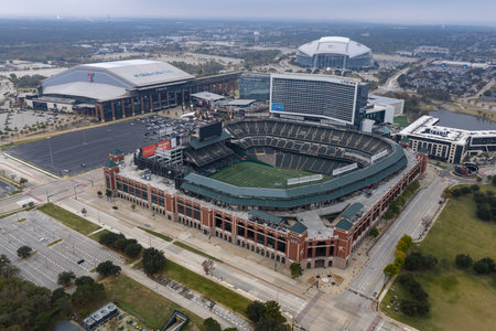 An aerial view captures Choctaw Stadium in Arlington, Texas, showcasing its multi-purpose design, historic baseball legacy, and current role hosting soccer, football, and major events.のeditorial素材