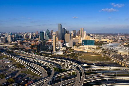 Aerial view of Dallas reveals a vast, vibrant metropolis, its skyline rising over highways and sprawling suburbs across the DFW regionâan inland hub of industry, transit, and culture.のeditorial素材