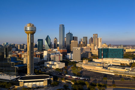Aerial view of Dallas reveals a vast, vibrant metropolis, its skyline rising over highways and sprawling suburbs across the DFW regionâan inland hub of industry, transit, and culture.のeditorial素材
