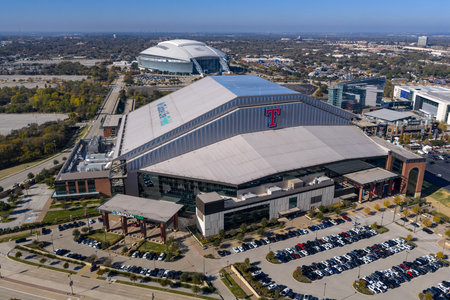 An aerial view reveals Globe Life Fieldâs sleek retractable roof and modern design in Arlington, rising beside its predecessor as the home of the Texas Rangers.のeditorial素材