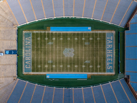 An aerial view of Kenan Stadium in Chapel Hill shows the historic UNC football venue nestled among trees, its classic bowl design anchoring campus since 1927 and home of the Tar Heels.のeditorial素材