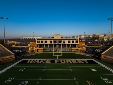 Aerial view of Allegacy Federal Credit Union Stadium shows Wake Forestâs 31,500-seat football home, nestled near Gene Hooks Field, with the Demon Deaconsâ historic West Campus athletic complex in view.のeditorial素材