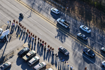 A group of about two dozen Buddhist monks continues their long journey toward the U.S. capital,...