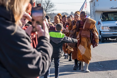 A group of about two dozen Buddhist monks continues their long journey toward the U.S. capital,...