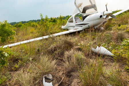 A small general aviation plane crash-lands at a rural airport, skidding into a nearby field. No...
