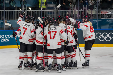 Team Canada celebrates after defeating Team Finland in the Preliminary Round Group A at the Milano Ice Park in Rho in MILAN, Italy during the 2026 Milano Cortina Winter Olympics.  Team Canada wins the game, 5:0.のeditorial素材
