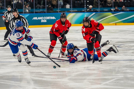 Forward Kelly Pannek #12 of Team United States plays against Team Canada in the Preliminary Round Group A at the Milano Santagiulia Ice Hockey Arena in MILAN, Italy during the 2026 Milano Cortina Winter Olympics. Team USA defeats Canada, 5-0.のeditorial素材
