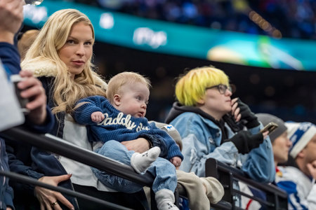 Fans cheer on their team during the Team Slovakia Vs Team Finland Group A match at the Milano Santagiulia Ice Hockey Arena in MILAN, Italy for the 2026 Milano Cortina Winter Olympics.  Team Finland wins the game, 4:1のeditorial素材