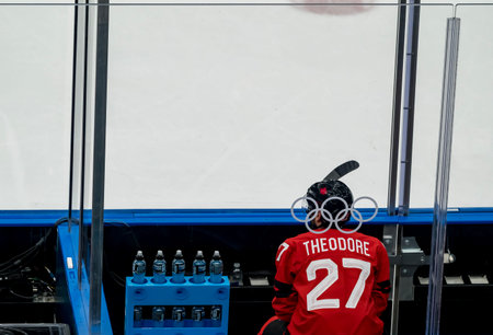 Defender Shea Theodore #27 of Team Canada serves out a penalty while playing against Team USA in the...