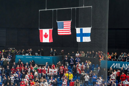 Team USA stands for the national anthem after defeating Team Canada 2:1 in overtime for the Mens Gold Medal Game at the Milano Santagiulia Ice Hockey Arena in MILAN, Italy during the 2026 Milano Cortina Winter Olympics.のeditorial素材