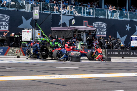 NTT INDYCAR SERIES driver, STING RAY ROBB (77) (USA) of Payette, ID, brings his car in for service...