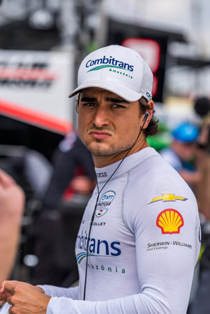 NTT INDYCAR SERIES driver, CAIO COLLET (R) (4) (BRA) of Sao Paulo, Brazil, prepares to practice for...