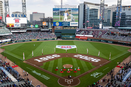 Opening Day energy fills Truist Park as fans in Braves gear cheer, wave flags, and soak in the excitement before the Royals vs Braves home opener begins in Atlanta, GA .のeditorial素材