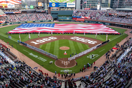 Opening Day in Atlanta dazzles as an American flag spans the field, fans rise cheering with pride...