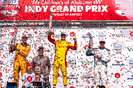 Christian Lundgaard, Alex Palou, and Graham Rahal celebrate at the podium for the Childrens of Alabama Indy Grand Prix at Barber Motorsports Park in BIRMINGHAM, AL, USA.のeditorial素材