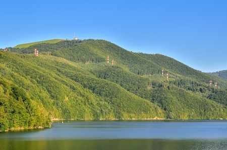 Summer mountain landscape. Beautiful green hills over blue water.の写真素材