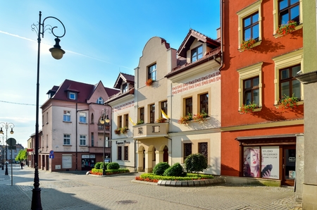 CHRZANOW, POLAND - AUGUST 19, 2017: Colorful buildings and shops in the city center of Chrzanow, Poland.のeditorial素材