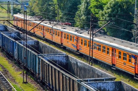 TRZEBINIA, POLAND - AUGUST 19, 2017: Freight and passenger train at the railway station in Trzebinia, Poland.のeditorial素材