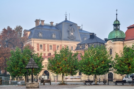PSZCZYNA, POLAND - OCTOBER 19, 2017: Castle and church on the beautiful historic market in Pszczyna, Poland.のeditorial素材