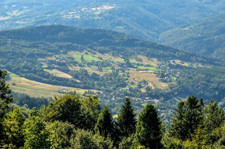 Summer hills landscape. Villages in beautiful mountainous scenery.の写真素材