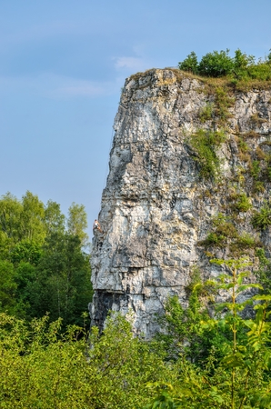 Beautiful summer landscape. Climber on the rocks of Twardowski at the lagoon of Zakrzowek in Krakow, Poland.の写真素材