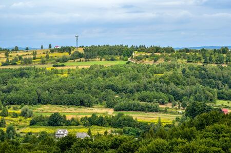 Summer rural landscape. Homes in the countryside among the green hills.の写真素材
