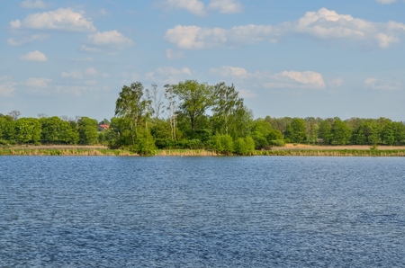 Beautiful rural landscape. Spring day over a beautiful pond.の写真素材