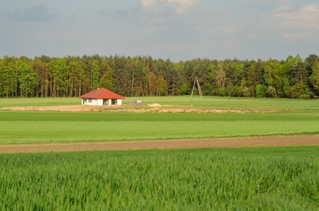Spring rural landscape. Construction of a new home in the countryside.の写真素材