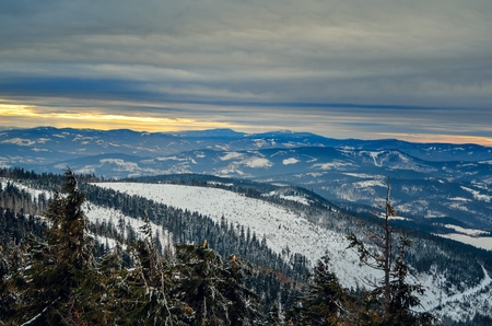 Fairytale winter mountain landscape. Beautiful evening light over the tops of the mountains.の写真素材