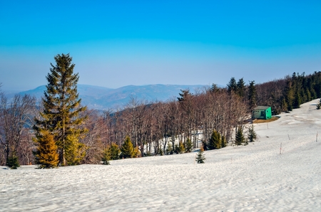 Beautiful winter landscape. Mountain pass covered with snow on a sunny day.の写真素材