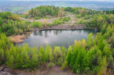 Beautiful spring mountain landscape. Quarry in the mountains by the lake.の写真素材