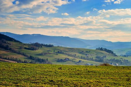 Beautiful rural mountain landscape. Cottages in the countryside on the hills.の写真素材