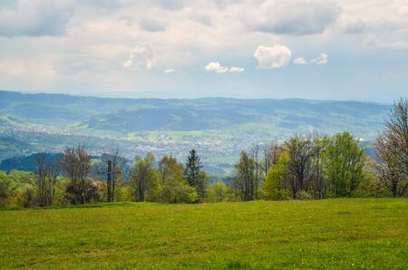 Beautiful spring mountain landscape. Green rural scenery on the hills.の写真素材