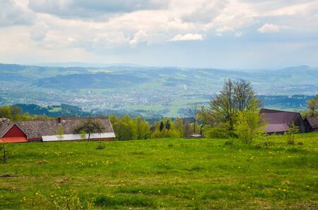 Beautiful spring mountain landscape. Green rural scenery on the hills.
