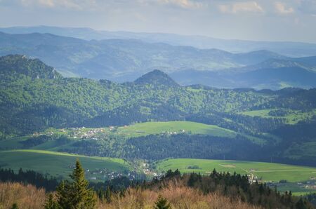 Beautiful mountain spring landscape. Picturesque valley and green hills.の写真素材