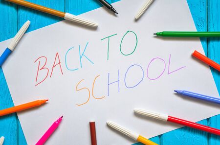 Creative idea depicting the return of children to school. School markers and a card with the text back to school.の写真素材