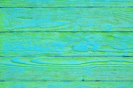 Wooden background texture. Creatively painted green and blue boards.の写真素材
