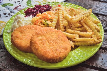 Tasty hot dinner. Quick dinner to prepare on a wooden table.