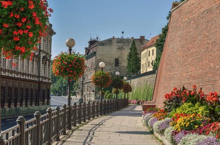 BIELSKO-BIALA, POLAND - SEPTEMBER 1, 2019: Walkway among pretty colorful flowers in the old town of Bielsko-Biala, Poland.のeditorial素材