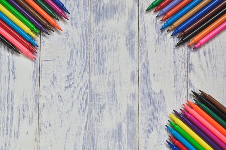 Creative concept with school supplies. Frame with school accessories  on a wooden background.の写真素材