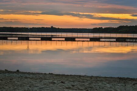 Beautiful colorful landscape. Sunset with a beautiful sky by the lake.の写真素材