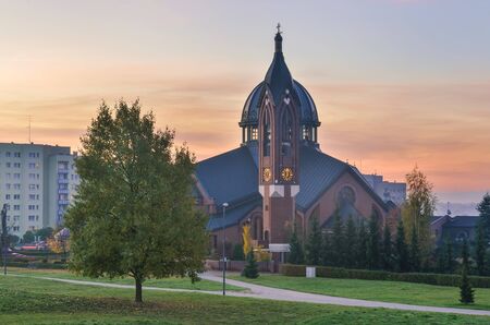 Beautiful morning autumnal place scenery. Church of the Blessed Carolina in Tychy, Poland.の写真素材