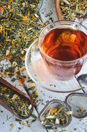 Interesting drink concept. Tea for a healthy complexion on a wooden table.の写真素材